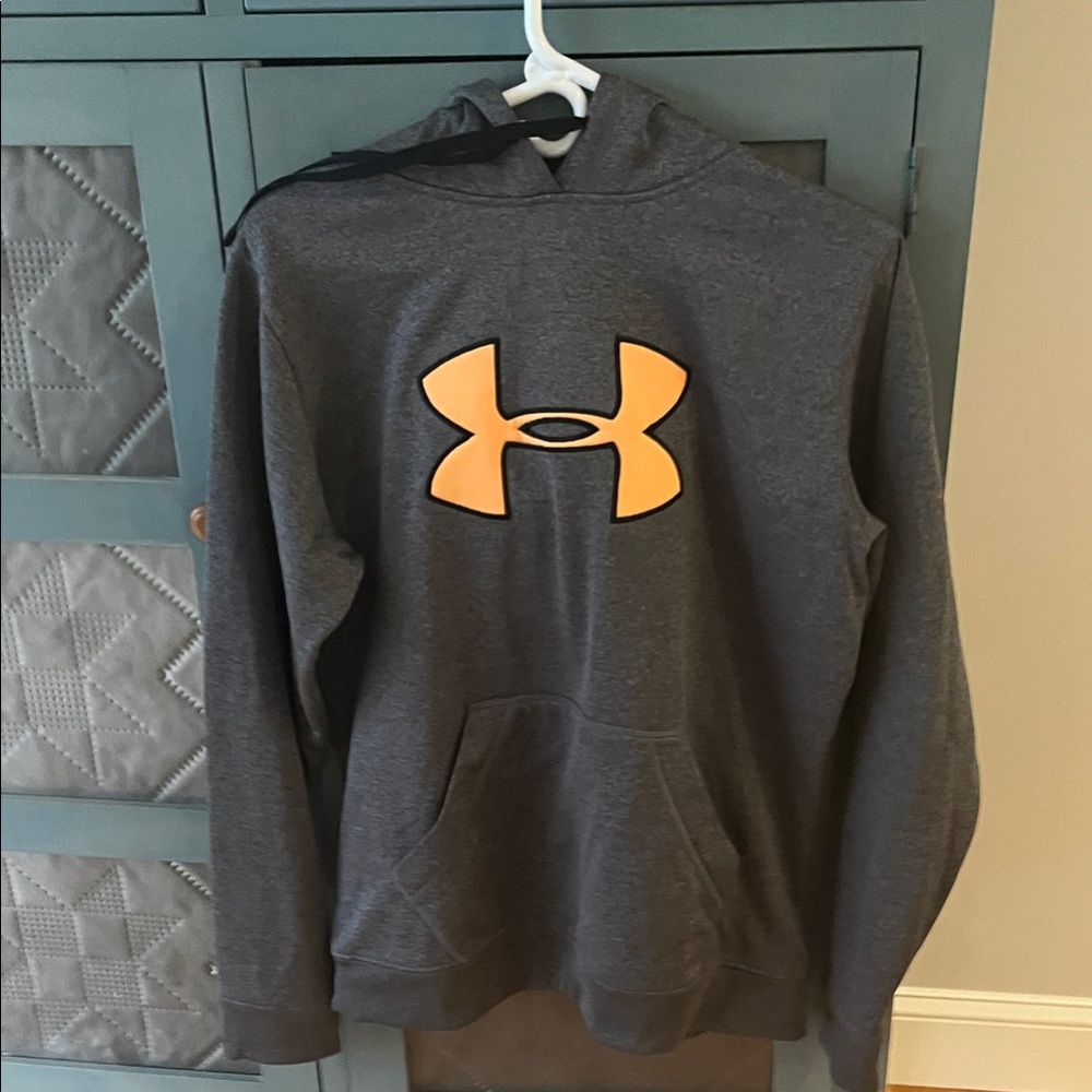 Under Armour women’s  Charcoal Hoodie with Bold Orange Emblem .Fleece lined